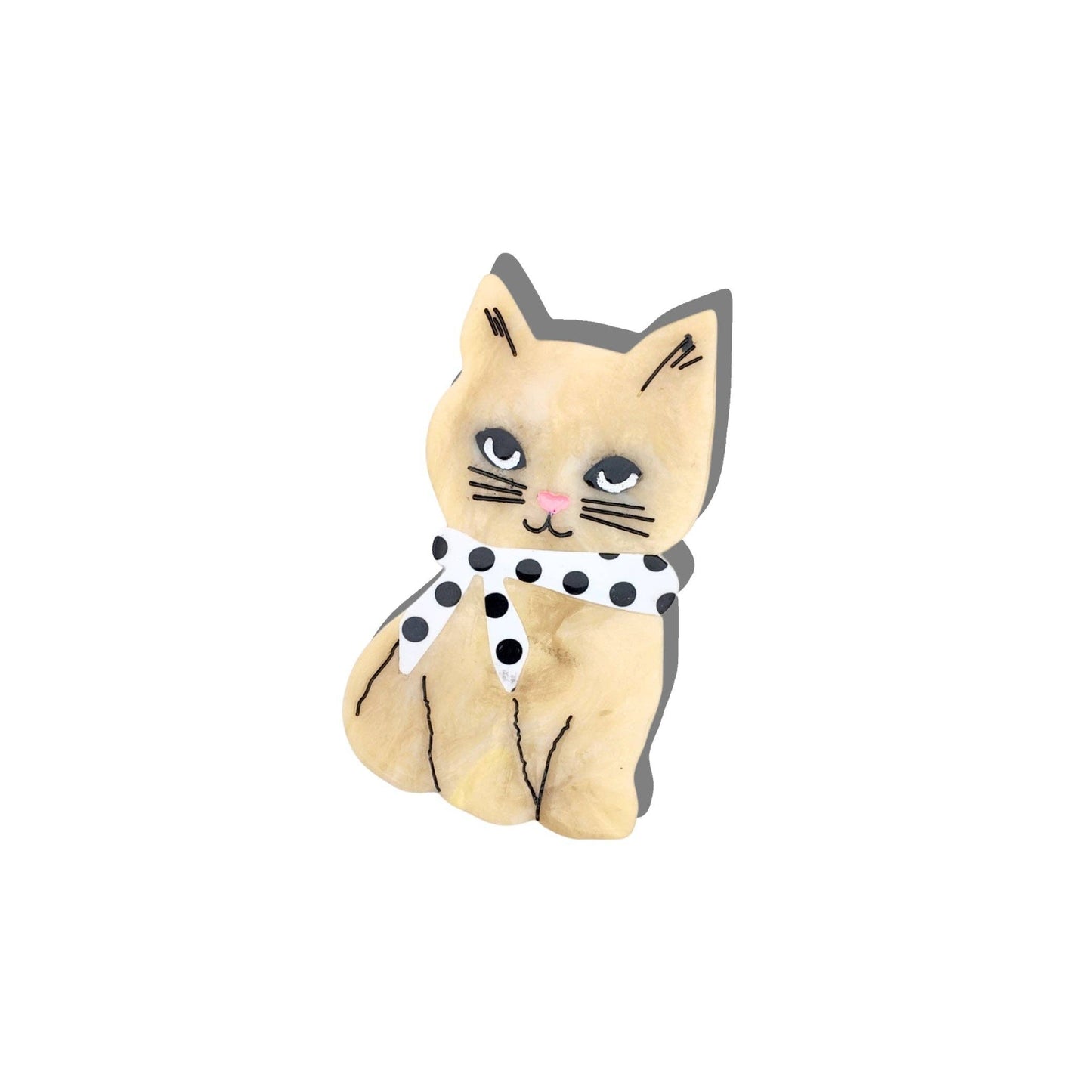 Small cat-shaped plush toy with a black and white collar on a white background