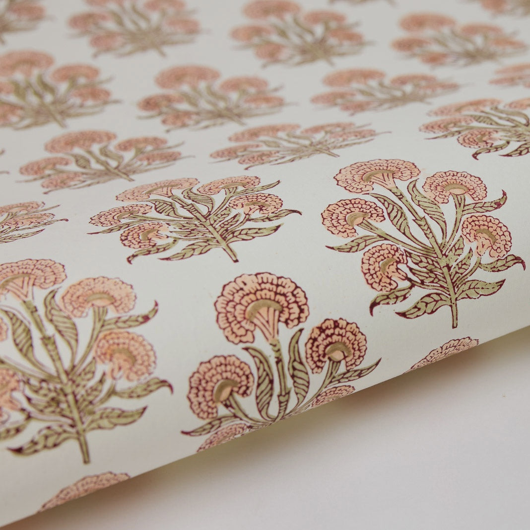 Floral patterned fabric with pink and green flowers on a white background